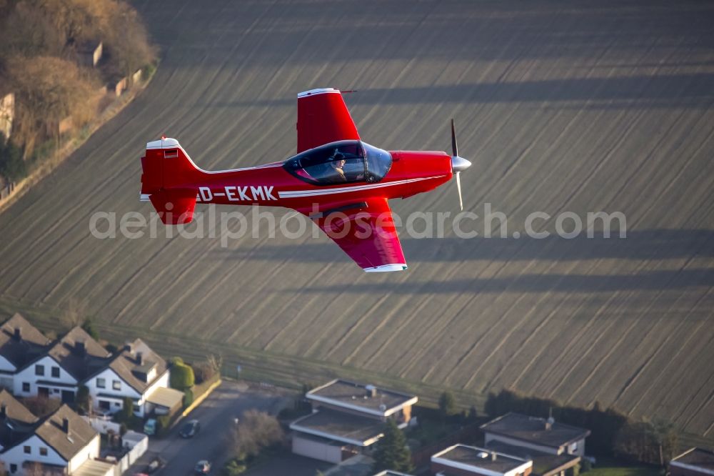 Hamm from above - Red Sport Aircraft Falco with the registration D-EKMK in flight in Hamm in North Rhine-Westphalia