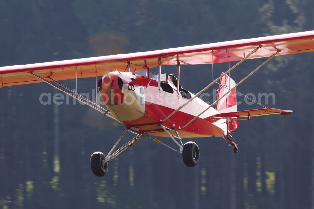 Bad Ditzenbach from above - Ultralight aircraft in flight above the sky Aircamper in roter Farbe mit der Kennung F-JRRL in Bad Ditzenbach in the state Baden-Wuerttemberg