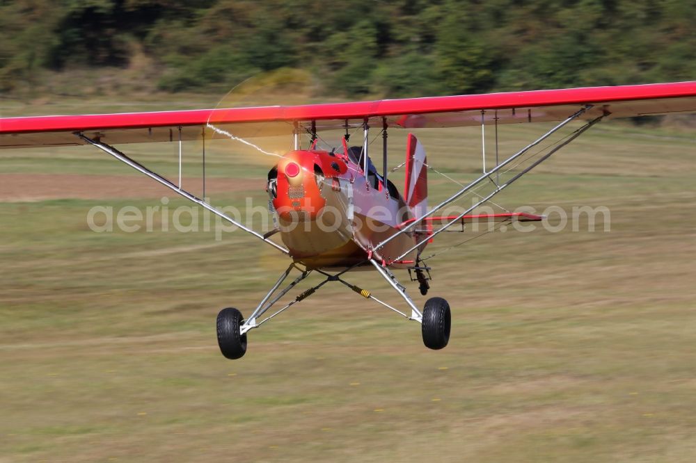 Aerial photograph Bad Ditzenbach - Ultralight aircraft in flight above the sky Aircamper in roter Farbe mit der Kennung F-JRRL in Bad Ditzenbach in the state Baden-Wuerttemberg