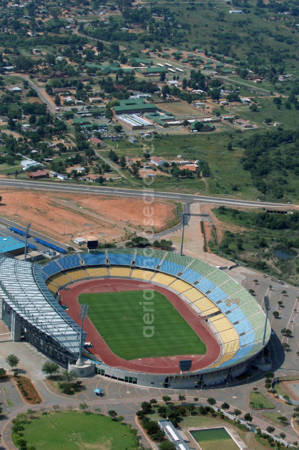 Rustenburg from the bird's eye view: Das Royal-Bafokeng-Stadion (auch Royal Bafokeng Sports Palace) ist ein Sportstadion in Phokeng bei Rustenburg, in der Nordwest Provinz von Südafrika. Das Stadion wurde nach dem Stamm der Royal Bafokeng Nation benannt, in dessen Besitz es sich befindet. Es wurde speziell für die Fußball-Welttmeisterschaft gebaut. View of the Royal Bafokeng Stadium in Rustenburg in the North West Province South Africa for the FIFA World Cup 2010.