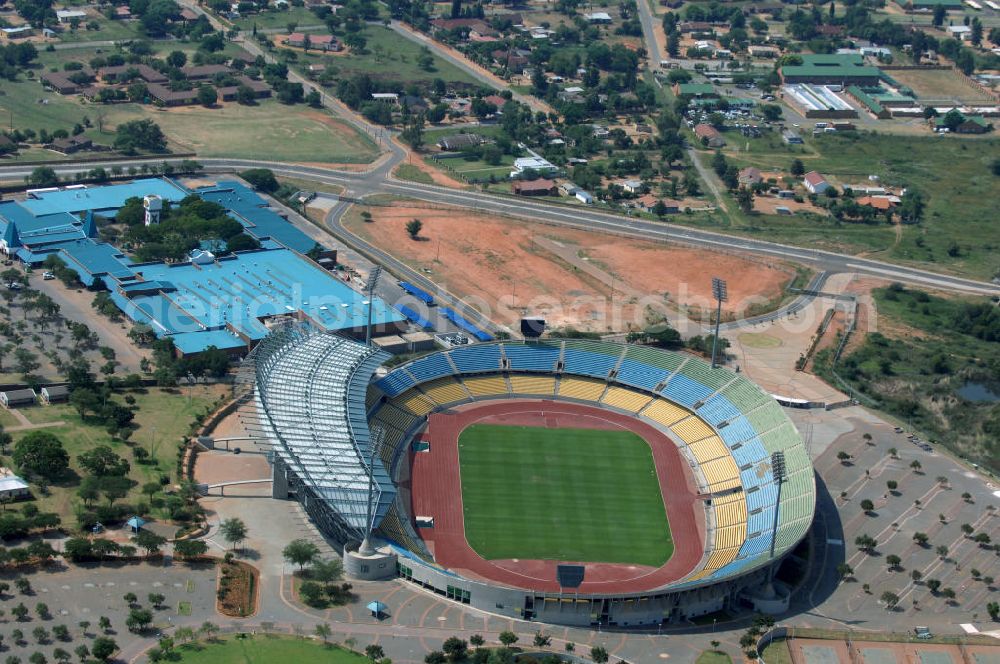 Aerial photograph Rustenburg - Das Royal-Bafokeng-Stadion (auch Royal Bafokeng Sports Palace) ist ein Sportstadion in Phokeng bei Rustenburg, in der Nordwest Provinz von Südafrika. Das Stadion wurde nach dem Stamm der Royal Bafokeng Nation benannt, in dessen Besitz es sich befindet. Es wurde speziell für die Fußball-Welttmeisterschaft gebaut. View of the Royal Bafokeng Stadium in Rustenburg in the North West Province South Africa for the FIFA World Cup 2010.