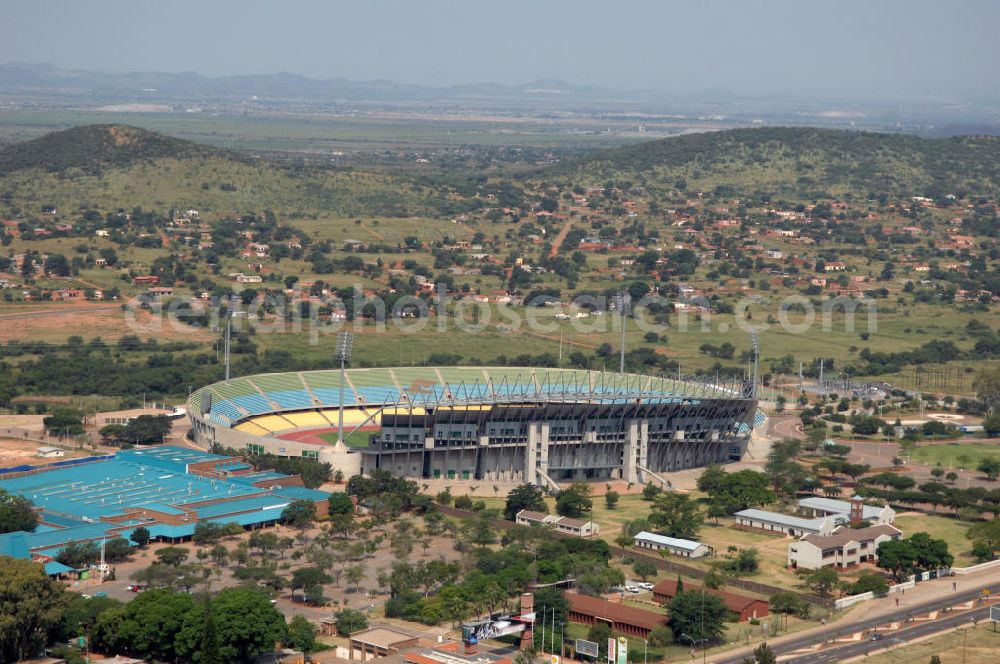 Rustenburg from the bird's eye view: Das Royal-Bafokeng-Stadion (auch Royal Bafokeng Sports Palace) ist ein Sportstadion in Phokeng bei Rustenburg, in der Nordwest Provinz von Südafrika. Das Stadion wurde nach dem Stamm der Royal Bafokeng Nation benannt, in dessen Besitz es sich befindet. Es wurde speziell für die Fußball-Welttmeisterschaft gebaut. View of the Royal Bafokeng Stadium in Rustenburg in the North West Province South Africa for the FIFA World Cup 2010.