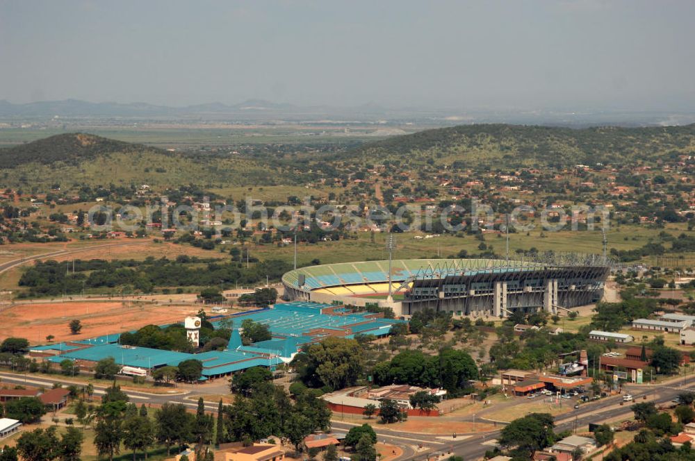 Rustenburg from above - Das Royal-Bafokeng-Stadion (auch Royal Bafokeng Sports Palace) ist ein Sportstadion in Phokeng bei Rustenburg, in der Nordwest Provinz von Südafrika. View of the Royal Bafokeng Stadium in Rustenburg in the North West Province South Africa for the FIFA World Cup 2010.