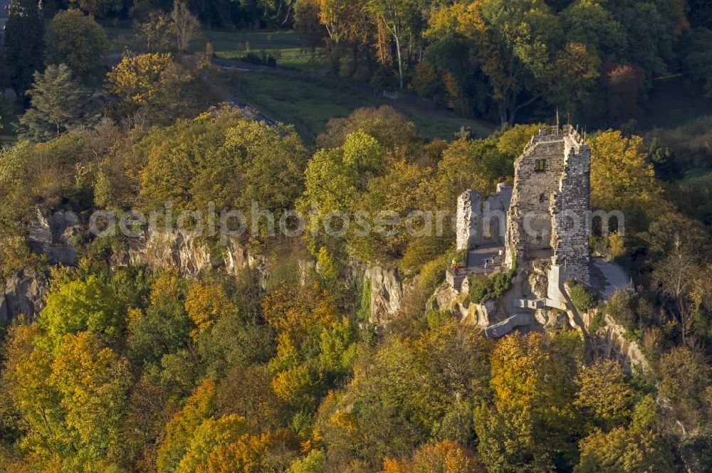 Aerial image Königswinter - Autumn view of the Drachenfels castle ruins in the autumn-colored forest at the bank of the Rhine in Königswinter in the federal state North Rhine-Westphalia. After major rock crashes the hilltop was secured by steel anchors and reinforcing steel. Meanwhile, the ruin was renovated