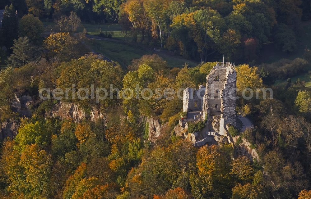 Aerial photograph Königswinter - Autumn view of the Drachenfels castle ruins in the autumn-colored forest at the bank of the Rhine in Königswinter in the federal state North Rhine-Westphalia. After major rock crashes the hilltop was secured by steel anchors and reinforcing steel. Meanwhile, the ruin was renovated