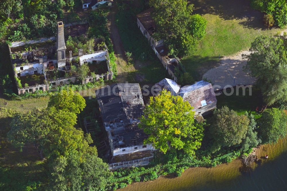 Rüdersdorf from the bird's eye view: Ruin the buildings and halls at the Stienitzsee in Ruedersdorf in the state Brandenburg, Germany