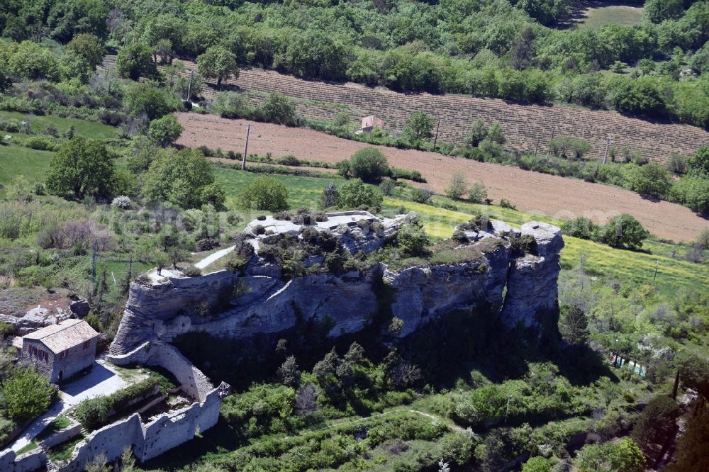 Aerial image Saignon - Ruins and vestiges of the former castle and fortress in Saignon in Provence-Alpes-Cote d'Azur, France