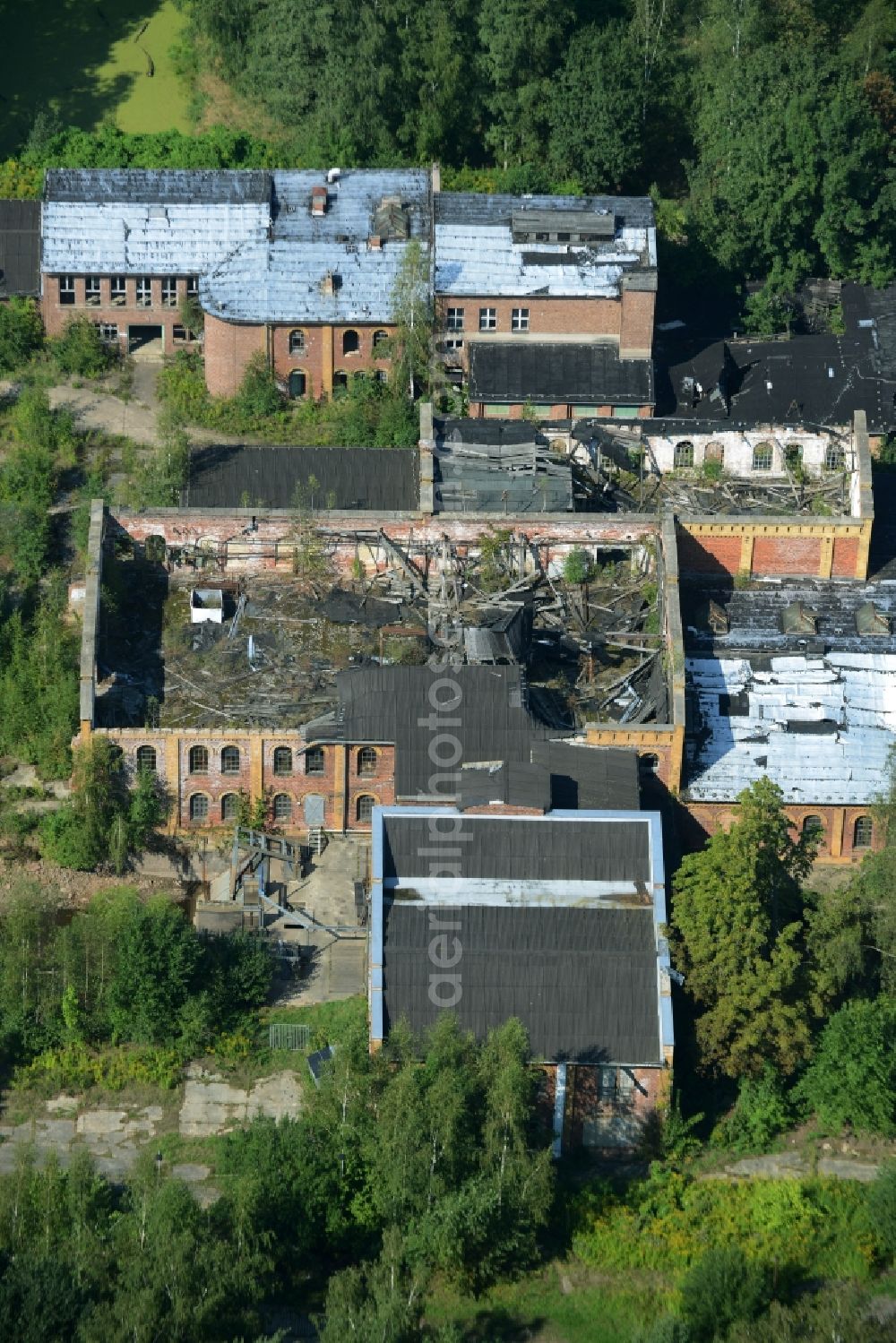 Aerial image Wolkenburg - Ruins of the paper factory in Wolkenburg in the state of Saxony. Caved-in roofs and remains of walls are visible