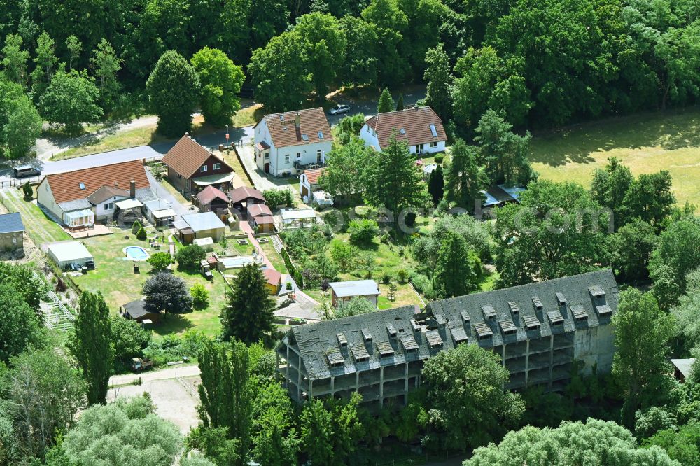 Aerial photograph Dallgow-Döberitz - Ruins of dilapidated warehouses and forwarding building of the storage ruin of the former army provision office from the Nazi era on Hauptstrasse in Dallgow-Doeberitz in the state Brandenburg, Germany