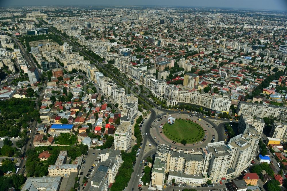 Aerial photograph Bukarest - View of the Round Square Piata Alba Iulia on the boulevard of Bulevardul Bd Unirii in the city center of Bucharest in Romania. The embossed in the style of Stalinist-dominated socialist architectural style houses line the streets and were up in the 70s of the previous century as a showpiece of socialist architecture