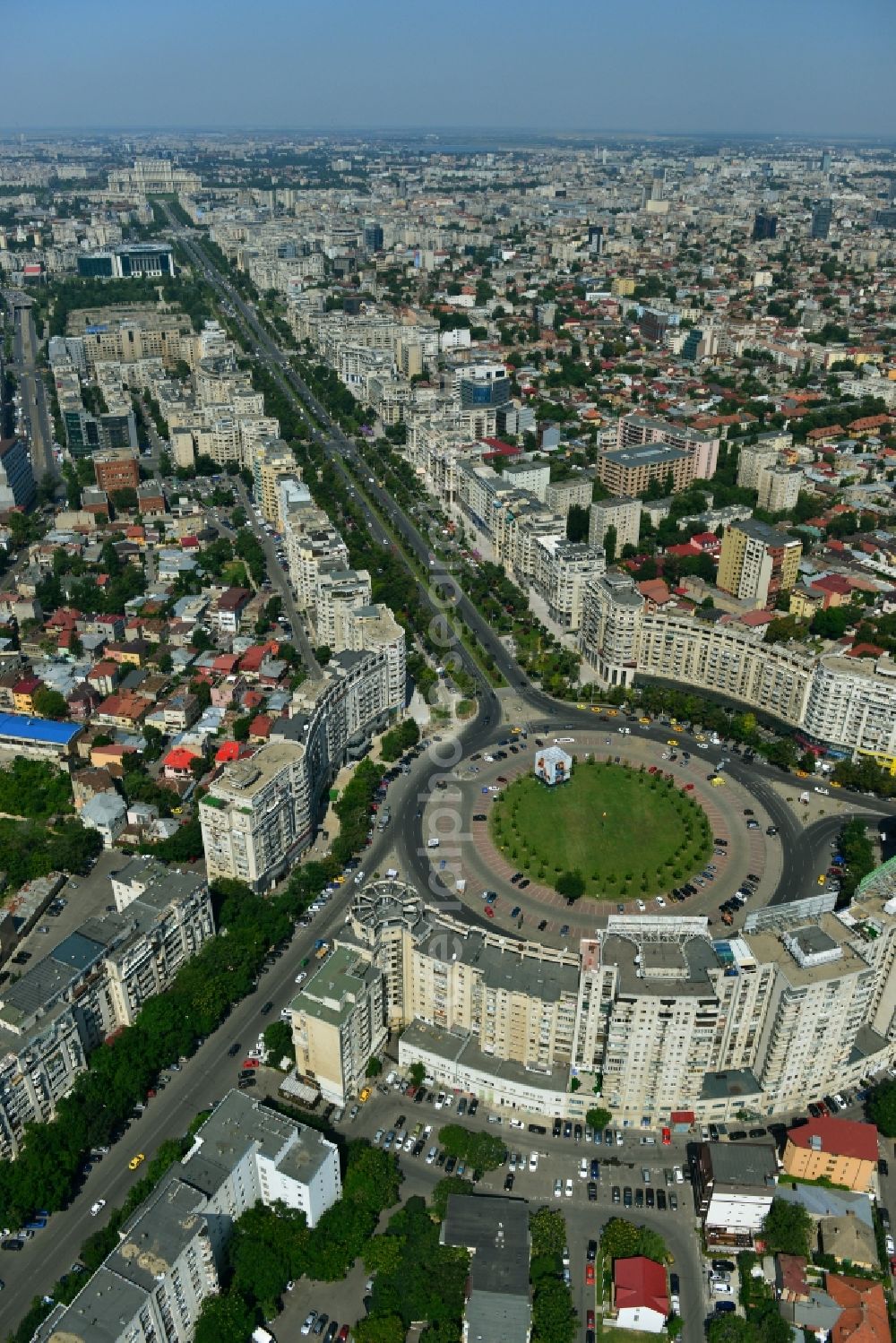 Bukarest from the bird's eye view: View of the Round Square Piata Alba Iulia on the boulevard of Bulevardul Bd Unirii in the city center of Bucharest in Romania. The embossed in the style of Stalinist-dominated socialist architectural style houses line the streets and were up in the 70s of the previous century as a showpiece of socialist architecture