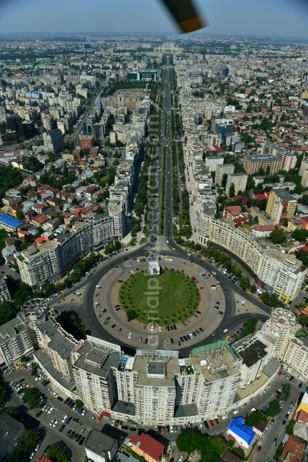 Bukarest from above - View of the Round Square Piata Alba Iulia on the boulevard of Bulevardul Bd Unirii in the city center of Bucharest in Romania. The embossed in the style of Stalinist-dominated socialist architectural style houses line the streets and were up in the 70s of the previous century as a showpiece of socialist architecture