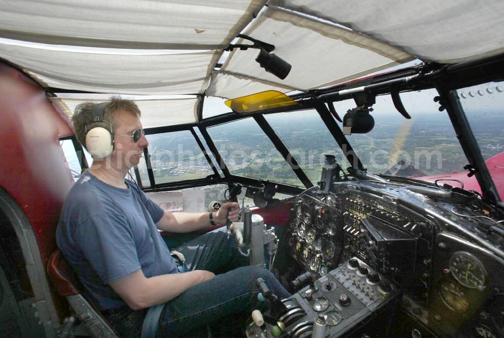 Oberhausen from the bird's eye view: Rundflug mit einem Doppeldecker- Flugzeug vom Typ Antonow AN-2 über dem Centro- Einkaufzentrum Oberhausen. Die AN-2 ist der größte noch fliegende Doppeldecker der Welt. Flight with a double-decker aircraft Antonov AN-2 above the Centro Shopping Centre Oberhausen. The AN-2 biplane flying still the largest in the world.