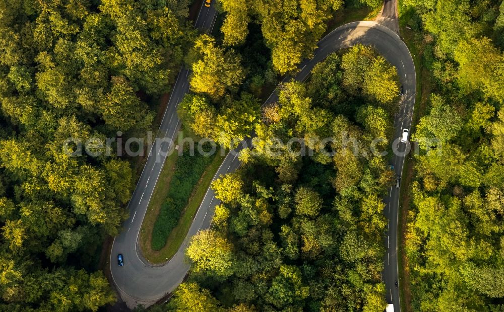 Aerial photograph Schmallenberg - S-curve on the road Boedefelder the L776 in autumnal deciduous forest in Schmallenberg in the state of North Rhine-Westphalia