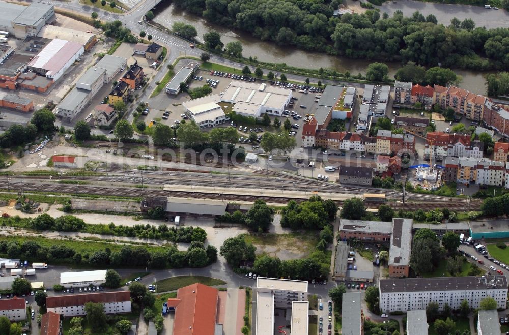 Jena from above - The Saalbahnhof station is a regional railway station in the borough north of Jena in Thuringia. The train tracks run along the course of the Saale through the valley. On Saalbahnhof the dealership JECAR & WAY GmbH has its headquarters