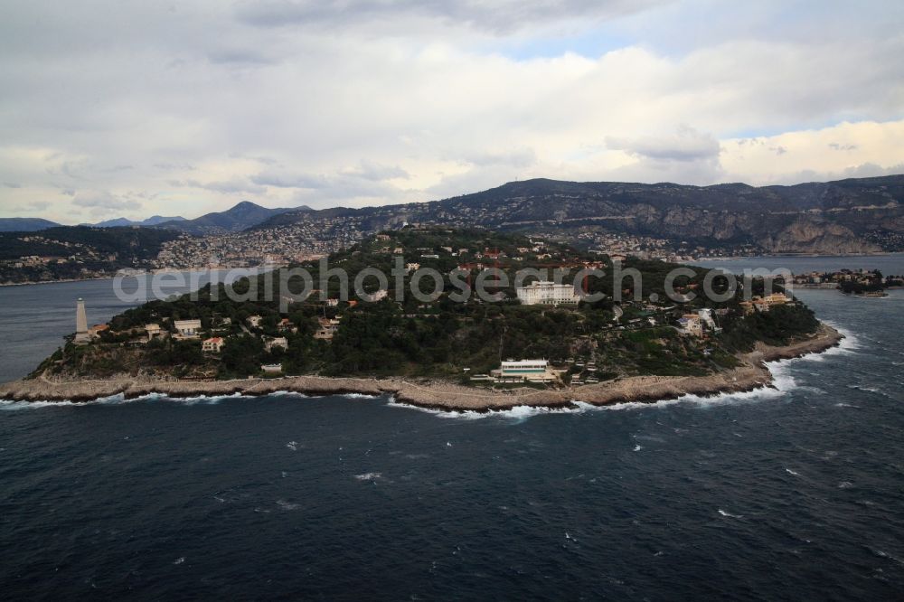 Saint-Jean-Cap-Ferrat from the bird's eye view: Stormy seas in the Mediterranean - Cap-Ferrat peninsula in France. On the coastline in the rear, the towns of Villefranche-sur-Mer and Beaulieu-sur-Mer. The surf strikes the shore at Pointe Causiniere below the Grand-Hotel du Cap-Ferrat