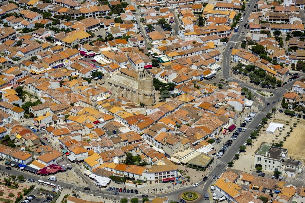 Aerial image Saintes-Maries-de-la-Mer - Religious building - church building in the Paroisse Saintes Maries de la Mer in Saintes-Maries-de-la-Mer in France