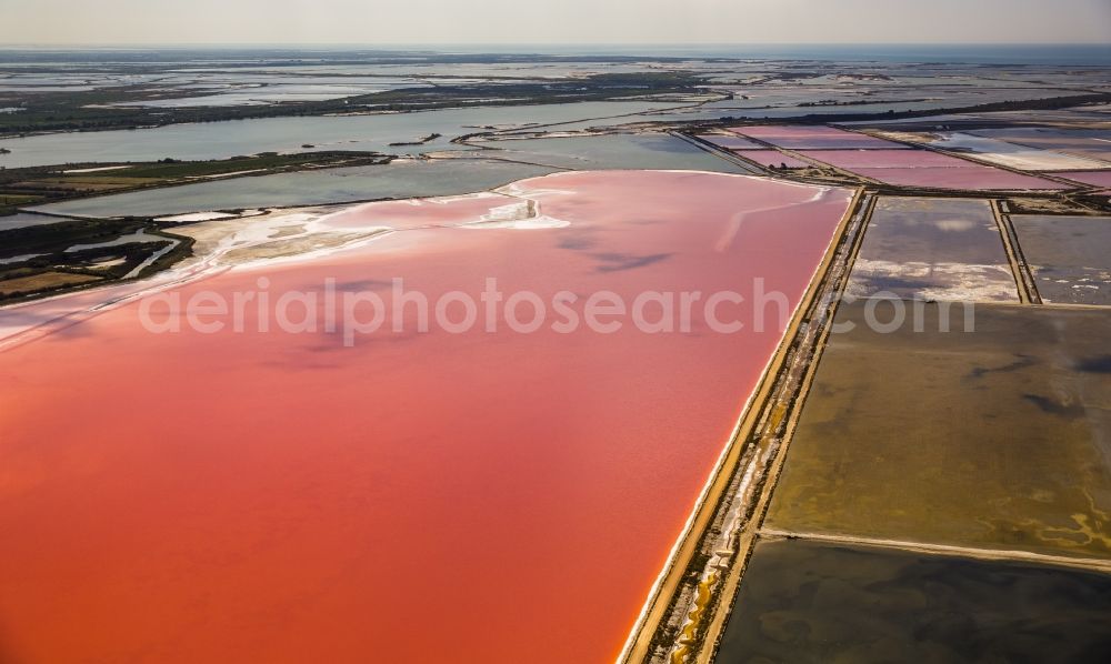 Aigues-Mortes from the bird's eye view: Red - Organge Salinen- landscape for sea salt production in Aigues-Mortes in the province of Languedoc-Roussillon in France