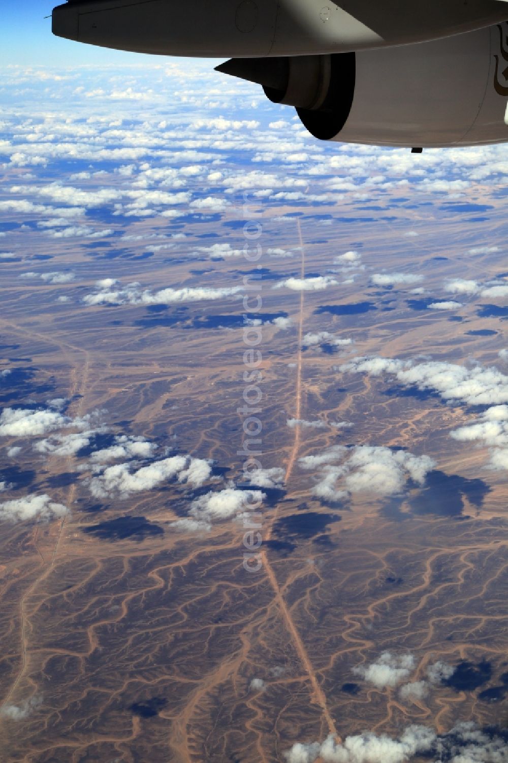 Ma'an from above - Sand, desert, dunes, clouds and rocky landscape while flying over the Arab Desert at Ma'an im Ma'an Governorate, Jordan