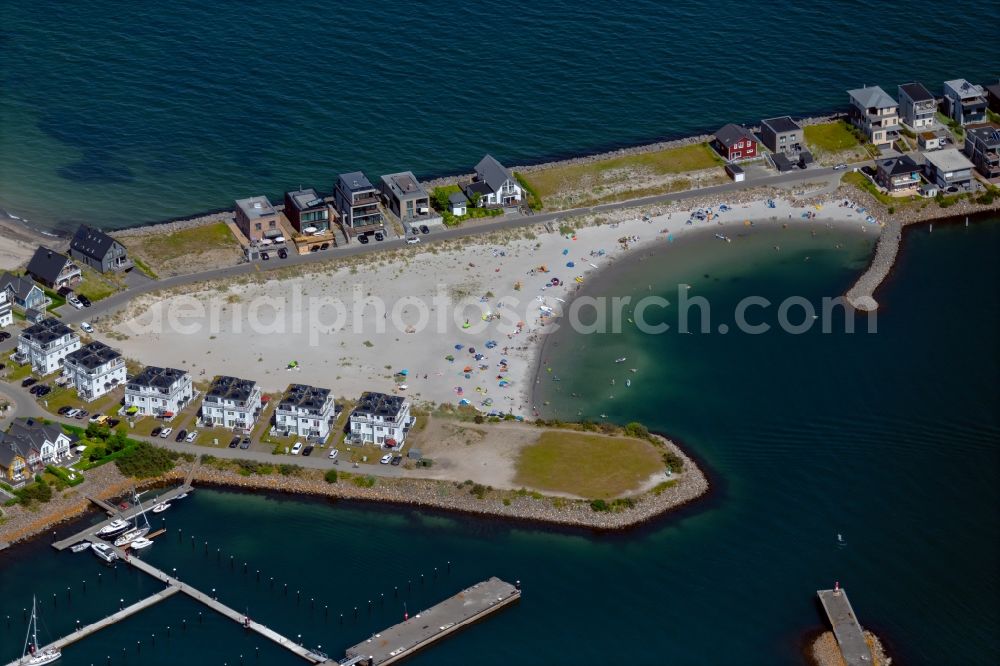 Kappeln from the bird's eye view: Beach landscape along the Badebucht Ostseeresort Olpenitz with vacation homes Auf der Ostsee - Am Yachthafen in Kappeln in the state Schleswig-Holstein, Germany