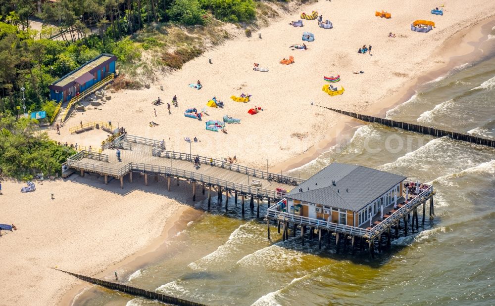 Aerial image Ustronie Morskie - Sand and beach landscape on the pier of Baltic Sea in Ustronie Morskie in West Pomerania, Poland