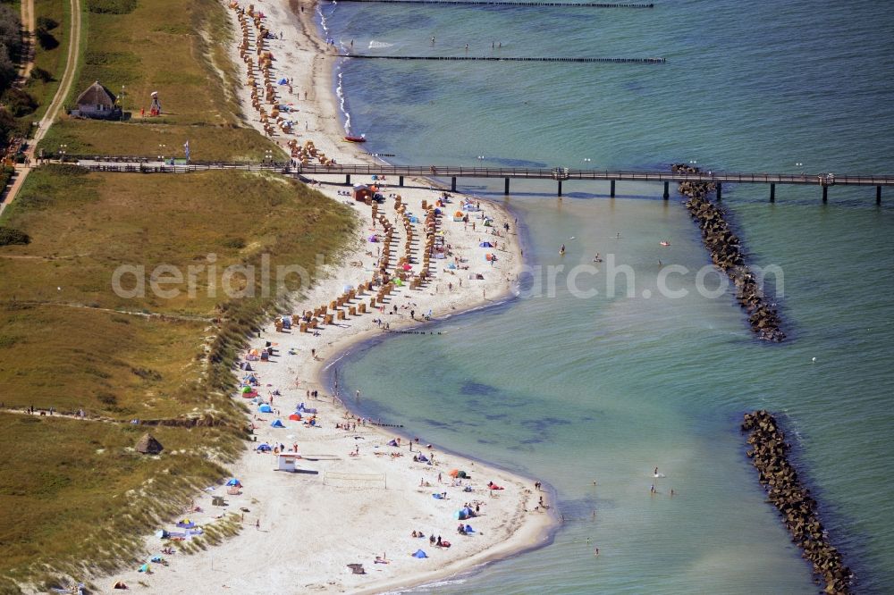 Wustrow from the bird's eye view: Sand and beach landscape on the pier of baltic see in Wustrow in the state Mecklenburg - Western Pomerania