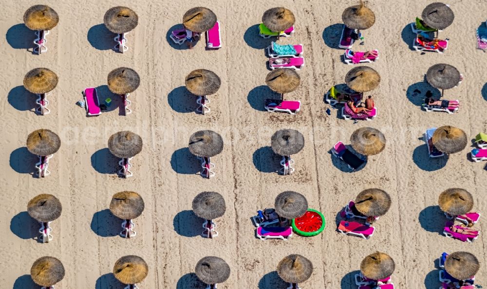 Cala Anguila-Cala Mendia from the bird's eye view: Beach landscape along the with umbrella - rows on CALA Estany d'en Mas in Cala Anguila-Cala Mendia in Balearic island of Mallorca, Spain