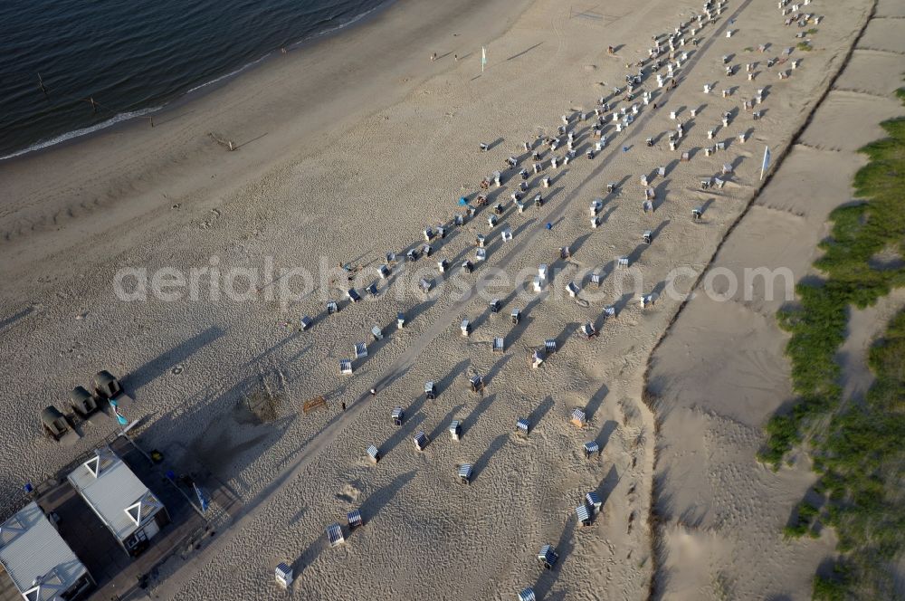 Norderney from above - Sandy beach with beach chair countryside on the North Sea coast of the island of Norderney in Lower Saxony