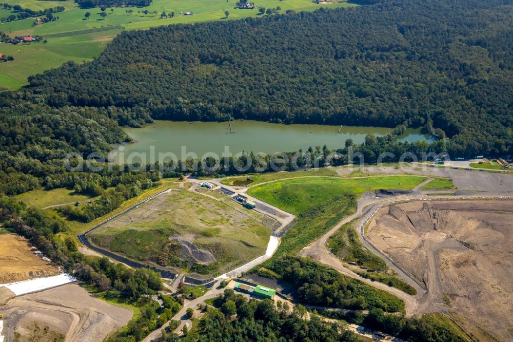 Aerial image Hünxe - Renovation, sealing and restoration work on the site of the refurbished landfill overlooking a lake in Huenxe in the state North Rhine-Westphalia, Germany