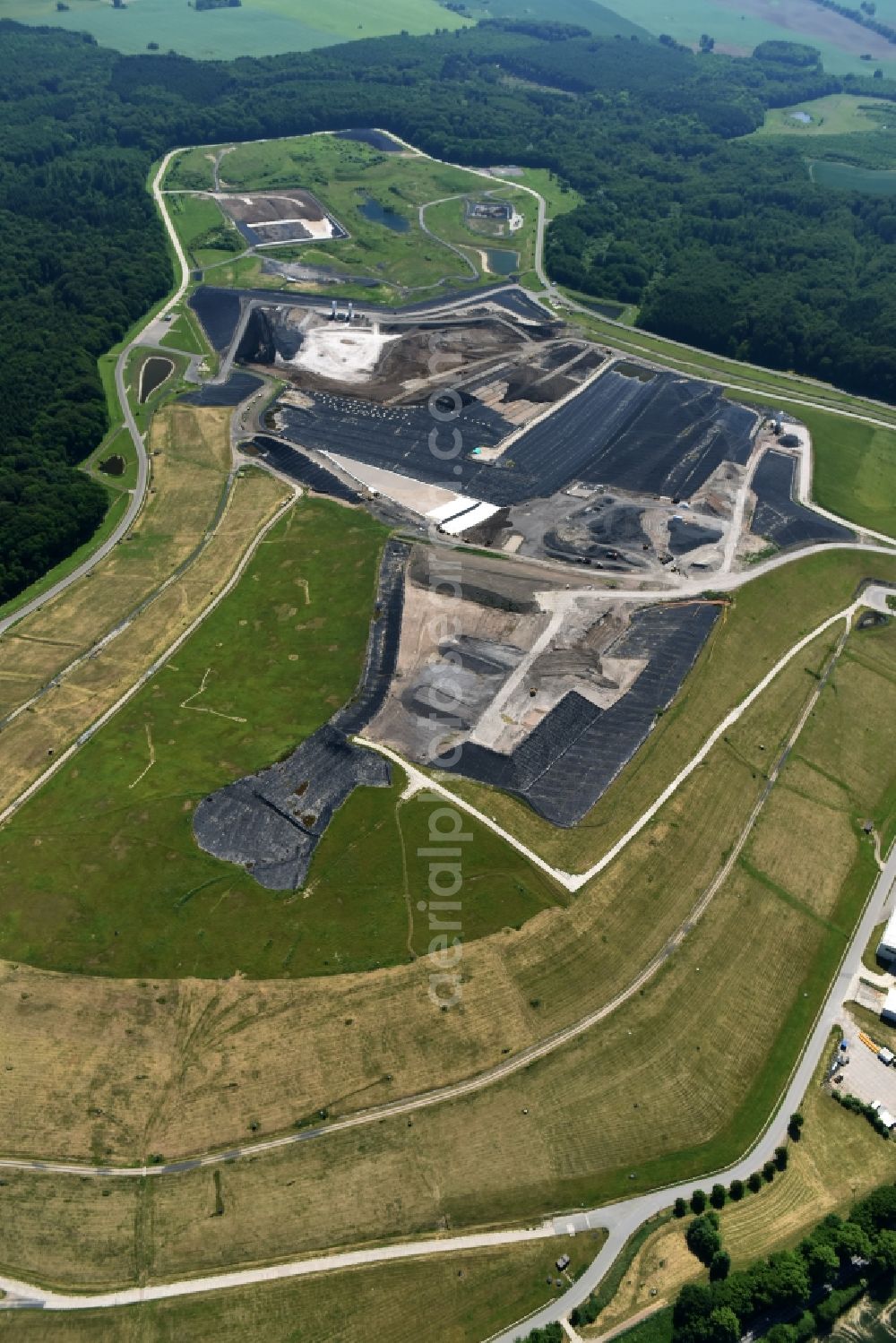 Selmsdorf from the bird's eye view: Renovation, sealing and restoration work on the site of the refurbished landfill Deponie Ihlenberg in Selmsdorf in the state Mecklenburg - Western Pomerania, Germany