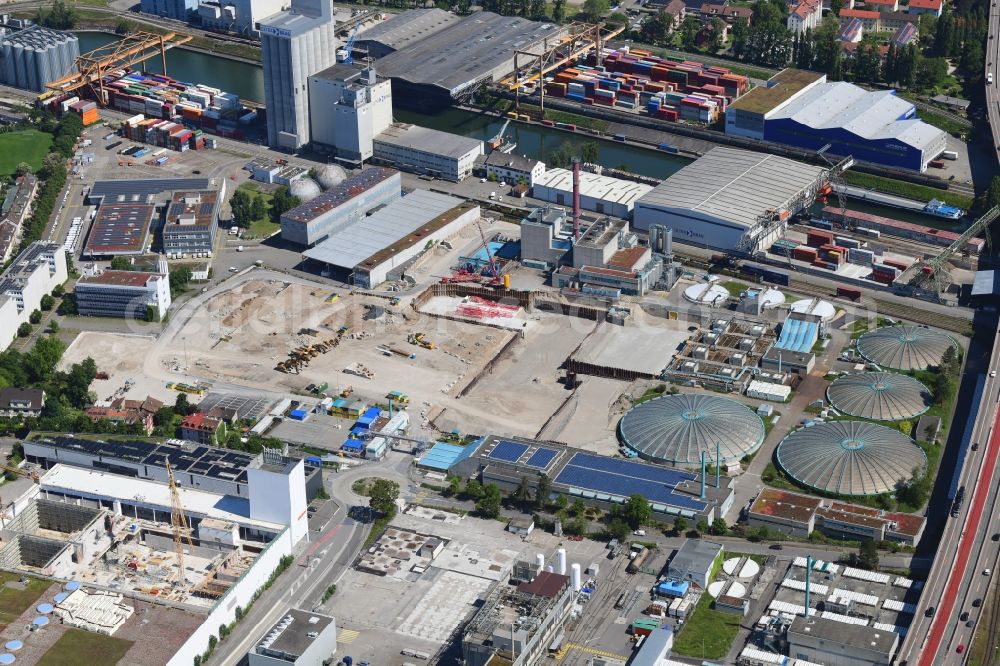 Basel from above - New construction site and extension of the sewage treatment basins and purification stages of the plant of ProRheno in the district Kleinhueningen in Basel, Switzerland