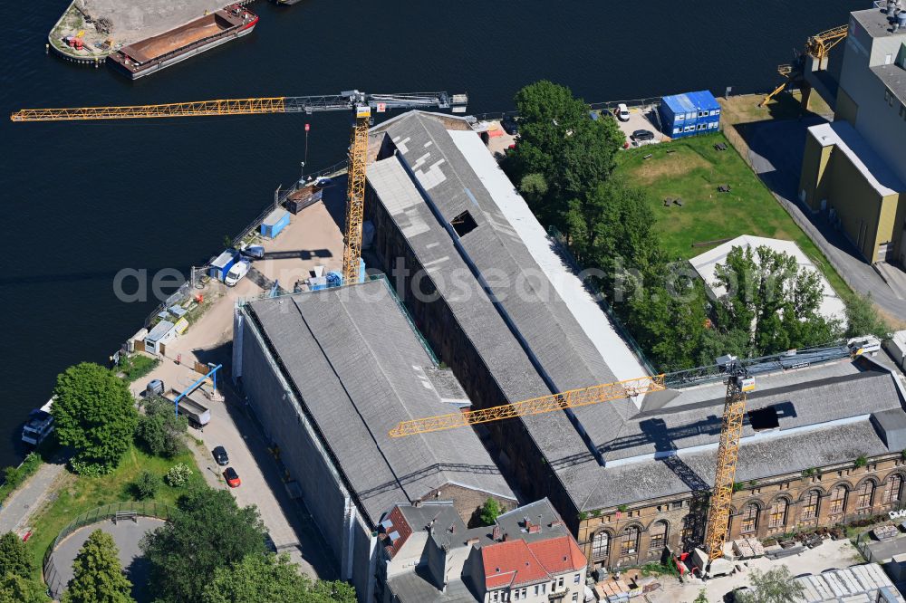 Berlin from above - Construction site for the conversion, modernization and renovation of a building complex Former Gun Foundry at the confluence of the Havel and Spree banks on Obermeierweg in the Spandau district of Berlin, Germany