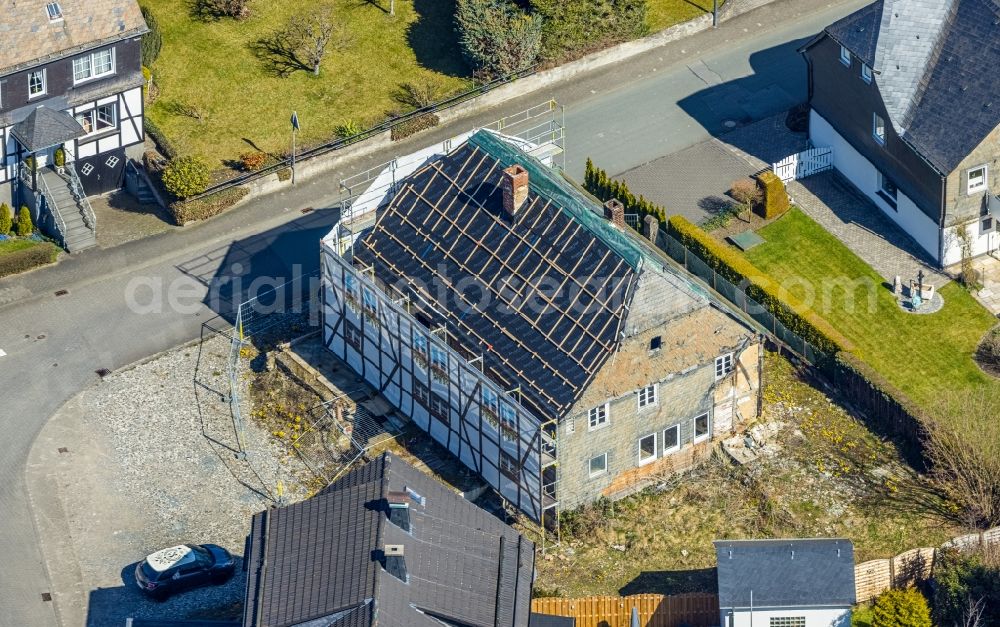 Ostwig from the bird's eye view: Construction site for reconstruction and modernization and renovation of a building Gasthof Alte Post in Ostwig at Sauerland in the state North Rhine-Westphalia, Germany