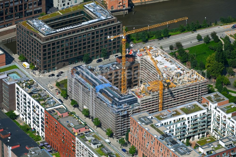 Aerial image Hamburg - Construction site for reconstruction and modernization and renovation of a building and construction of new building next at Kulturcompagnie on Shanghaiallee in the district HafenCity in Hamburg, Germany