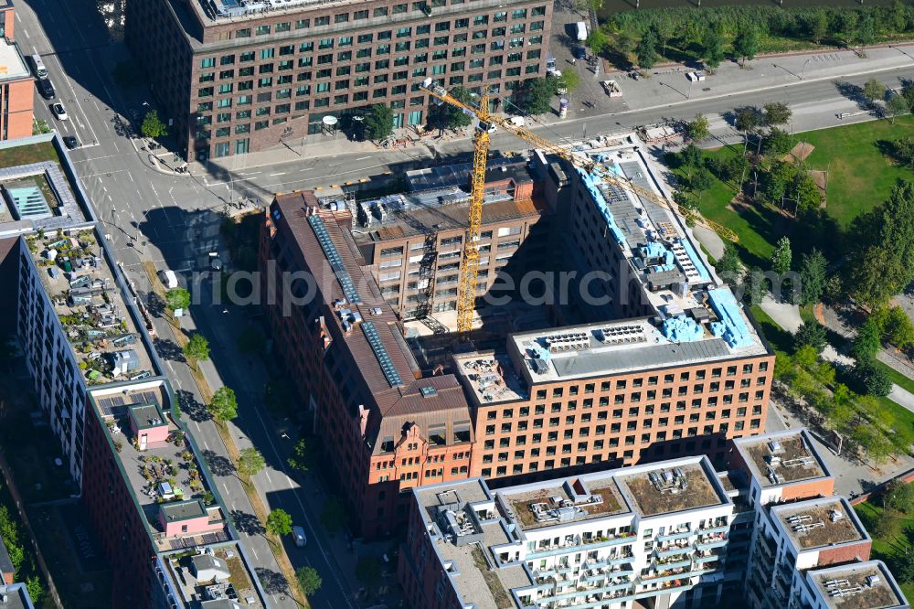 Hamburg from above - Construction site for reconstruction and modernization and renovation of a building and construction of new building next at Kulturcompagnie on Shanghaiallee in the district HafenCity in Hamburg, Germany