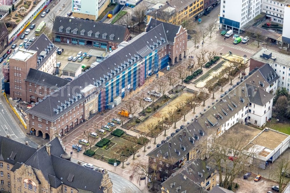 Oberhausen from the bird's eye view: Construction site for reconstruction and modernization and renovation of a building of Polizeiwache Alt Oberhausen am Friedensplatz in Oberhausen at Ruhrgebiet in the state North Rhine-Westphalia, Germany