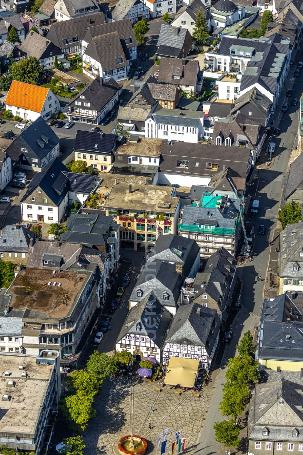 Brilon from the bird's eye view: Construction site for reconstruction and modernization and renovation of a building on Steinweg corner Springstrasse in Brilon in the state North Rhine-Westphalia, Germany