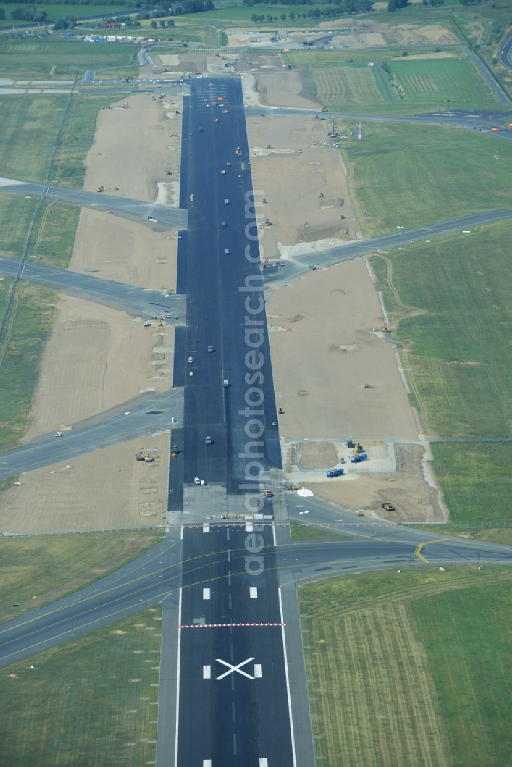 Schönefeld from the bird's eye view: Refurbishment locked Nordbahn - runway on the grounds of the airport in Schoenefeld in Brandenburg