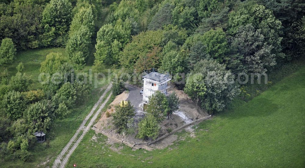 Aerial photograph Eisenach - Sanierung eines Grenzwachturms an der ehemaligen innerdeutschen Grenze in der Nähe von Eisenach. Das Land Thüringen hat zahlreiche Überreste der Grenzanlagen unter Denkmalschutz gestellt. Renovation of a sentry tower at the former inner-German border near Eisenach. The state of Thuringia has listed many remains of the border.