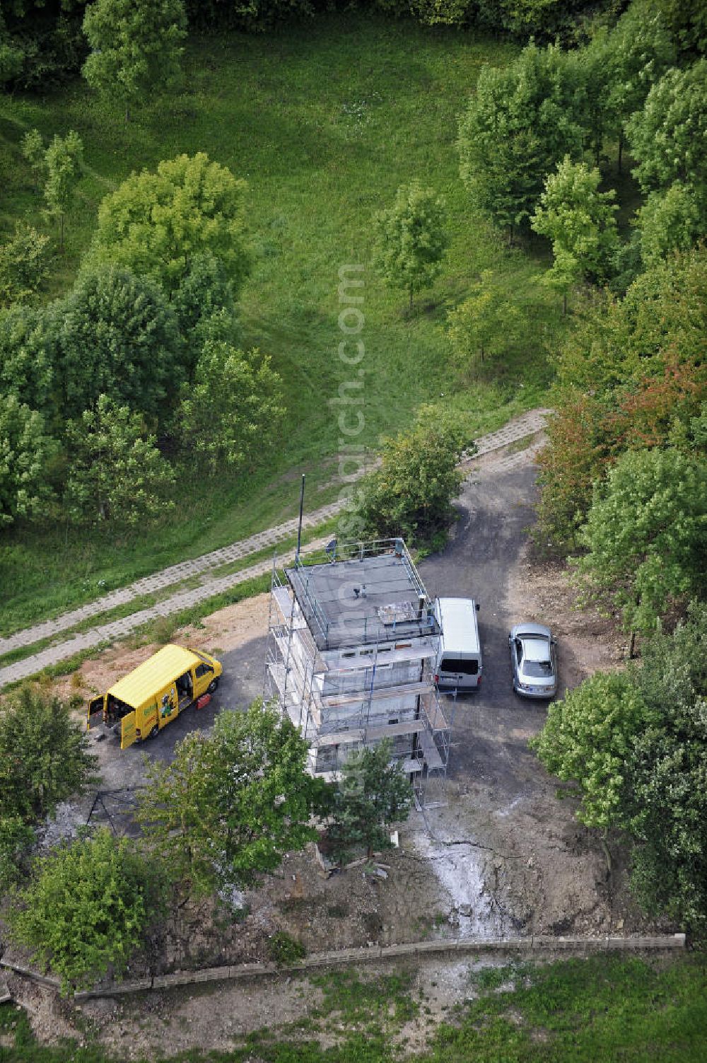 Aerial image Eisenach - Sanierung eines Grenzwachturms an der ehemaligen innerdeutschen Grenze in der Nähe von Eisenach. Das Land Thüringen hat zahlreiche Überreste der Grenzanlagen unter Denkmalschutz gestellt. Renovation of a sentry tower at the former inner-German border near Eisenach. The state of Thuringia has listed many remains of the border.