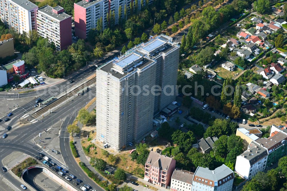 Aerial image Berlin - Construction site for the renovation and modernization of the high-rise buildings in the residential area to the low-energy house on street Rhinstrasse in Berlin, Germany