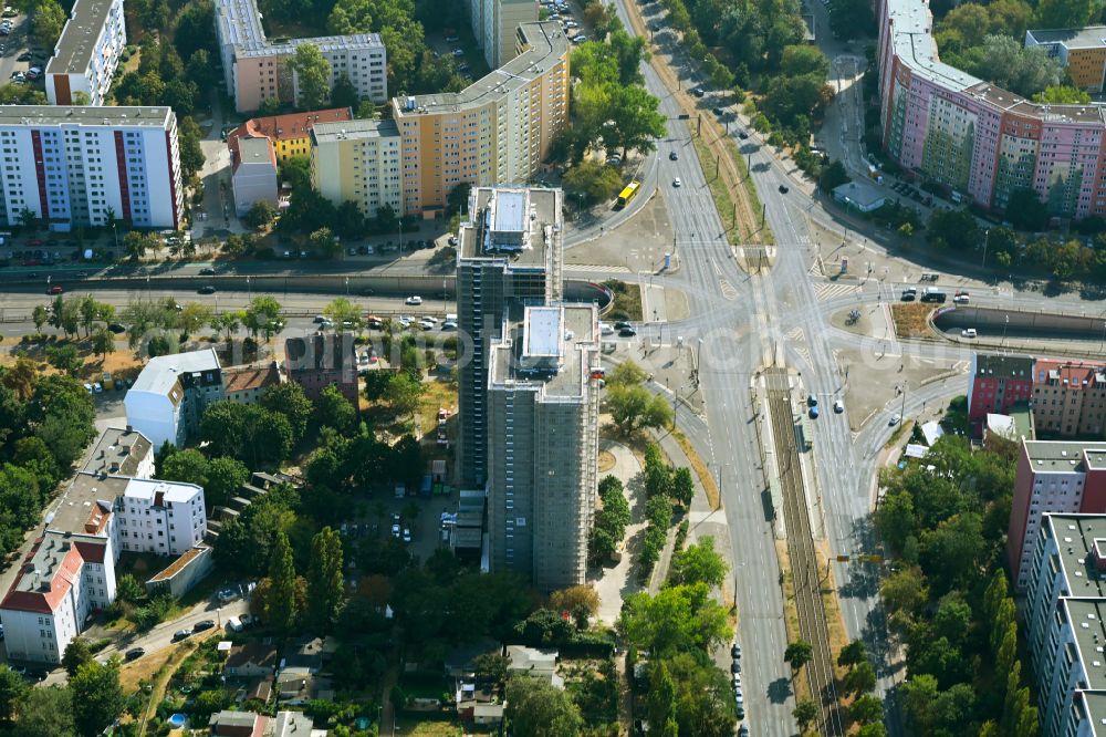 Berlin from above - Construction site for the renovation and modernization of the high-rise buildings in the residential area to the low-energy house on street Rhinstrasse in Berlin, Germany