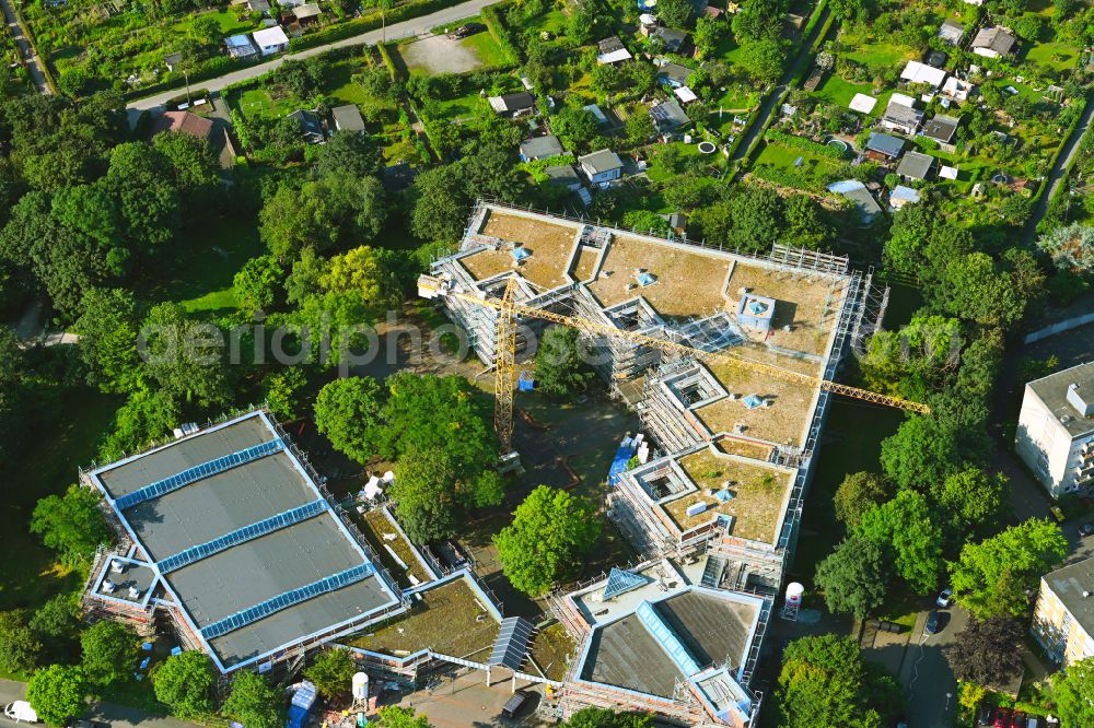 Köln from the bird's eye view: Construction site for the renovation and modernization of a daycare kindergarten Kinderbetreuung in Koeln - Mini Montis e.V. on street Escher Strasse in the district Bilderstoeckchen in Cologne in the state North Rhine-Westphalia, Germany