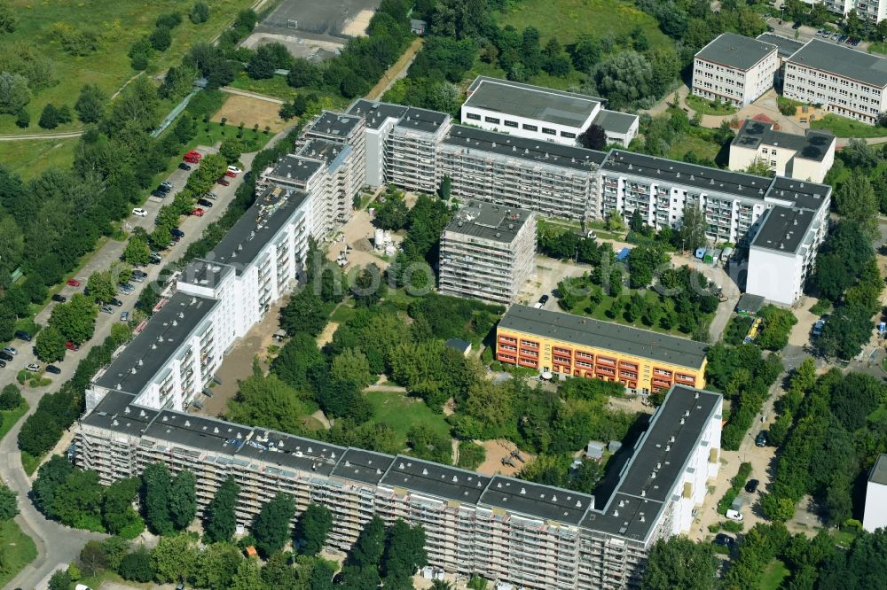 Berlin from above - Restoration and modernization of skyscrapers in the residential area of industrially manufactured settlement on Kyritzer Strasse in the district Marzahn-Hellersdorf in Berlin, Germany