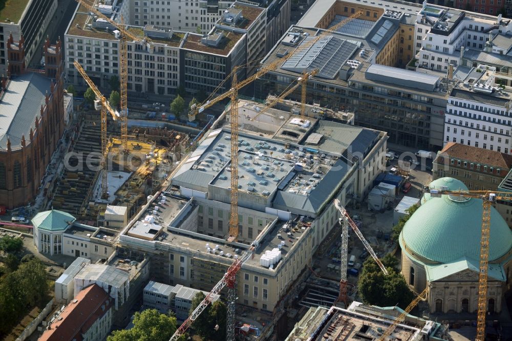 Berlin from above - View of the reconstruction and renovation of the building of the Staatsoper Unter den Linden in Berlin at Bebelplatz. It is the oldest opera house and theater building in Berlin. A new building will serve as stacks and warehouse for the Staatsoper Komplex. The architect HG Merz is a overseeing the reconstruction of the historical building complex