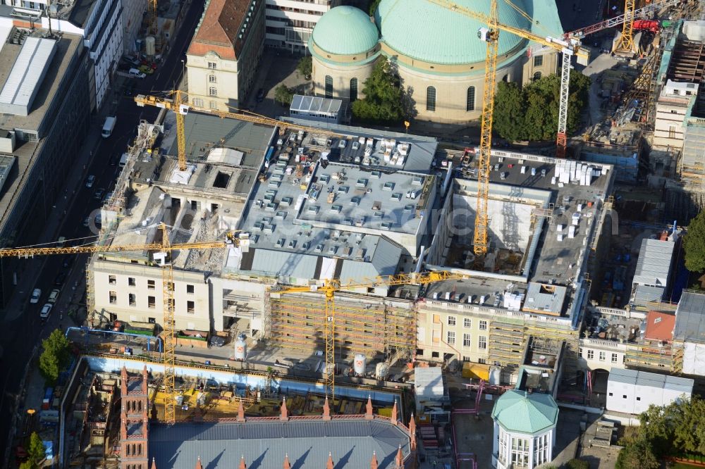 Berlin from the bird's eye view: View of the reconstruction and renovation of the building of the Staatsoper Unter den Linden in Berlin at Bebelplatz. It is the oldest opera house and theater building in Berlin. A new building will serve as stacks and warehouse for the Staatsoper Komplex. The architect HG Merz is a overseeing the reconstruction of the historical building complex