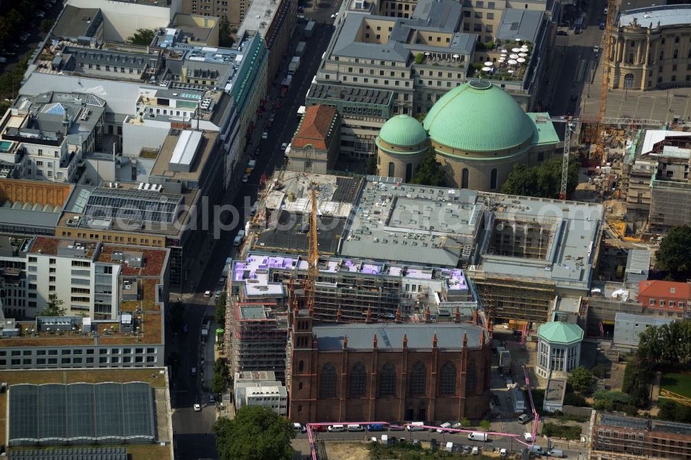 Berlin from above - View of the reconstruction and renovation of the building of the Staatsoper Unter den Linden in Berlin at Bebelplatz. It is the oldest opera house and theater building in Berlin. A new building will serve as stacks and warehouse for the Staatsoper Komplex. The architect HG Merz is a overseeing the reconstruction of the historical building complex