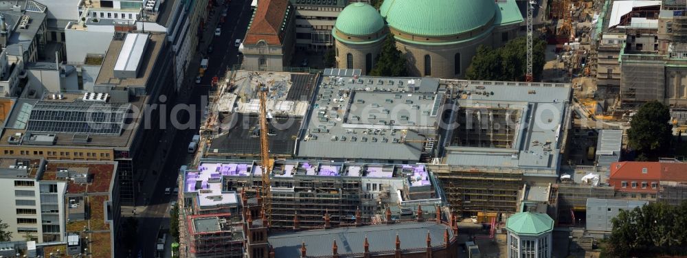 Berlin from the bird's eye view: View of the reconstruction and renovation of the building of the Staatsoper Unter den Linden in Berlin at Bebelplatz. It is the oldest opera house and theater building in Berlin. A new building will serve as stacks and warehouse for the Staatsoper Komplex. The architect HG Merz is a overseeing the reconstruction of the historical building complex