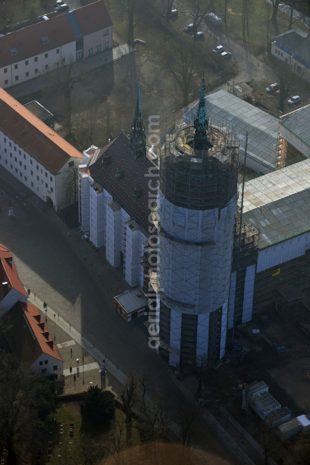 Aerial photograph Wittenberg - View of the castle church of Wittenberg. The castle with its 88 m high Gothic tower at the west end of the town is a UNESCO World Heritage Site. The first mention of the castle dates from 1187. It gained fame as in 1517 the Wittenberg Augustinian monk and theology professor Martin Luther spread his 95 disputation