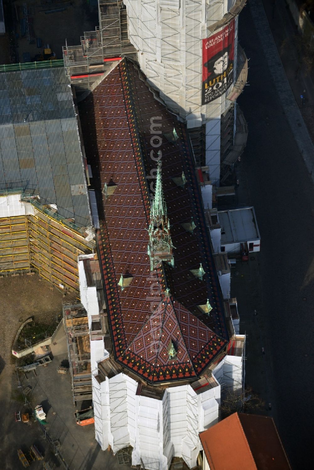 Wittenberg from above - View of the castle church of Wittenberg. The castle with its 88 m high Gothic tower at the west end of the town is a UNESCO World Heritage Site. The first mention of the castle dates from 1187. It gained fame as in 1517 the Wittenberg Augustinian monk and theology professor Martin Luther spread his 95 disputation